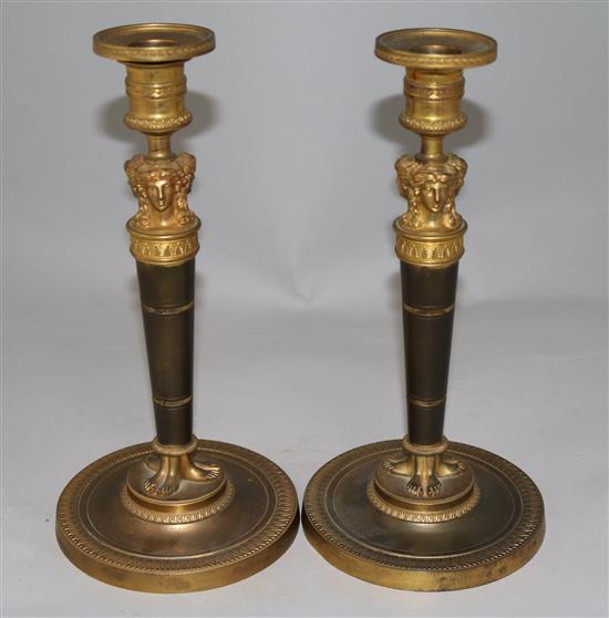 A pair of Empire style bronzed ormolu candlesticks, 10.5in.